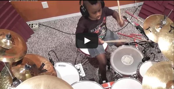 kid plays drum